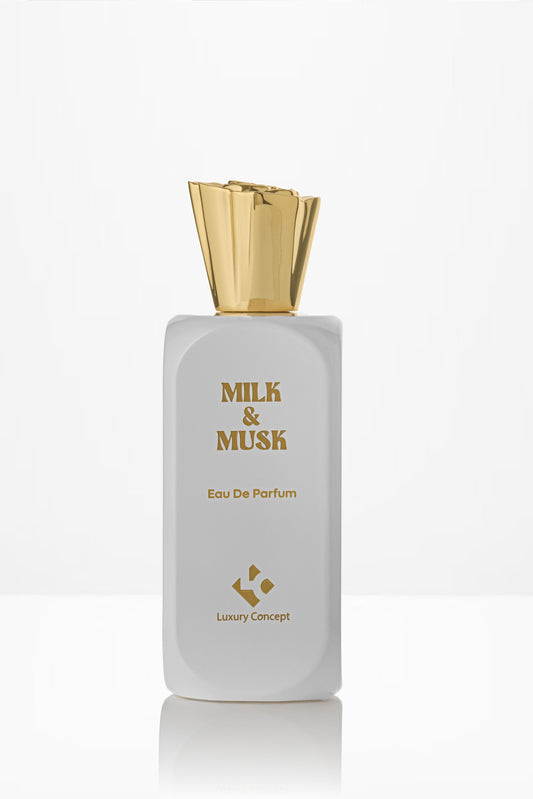 Perfume bottle labeled 'Milk & Musk' with a gold cap on a white background