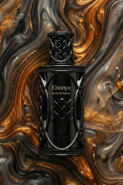 Black perfume bottle labeled 'Ebonyx' on a swirling gold and black background