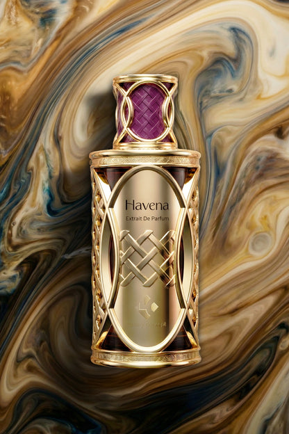 Gold Havena perfume bottle on a swirling marble background
