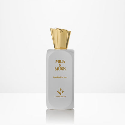 Perfume bottle labeled 'Milk & Musk' with a gold cap on a white background