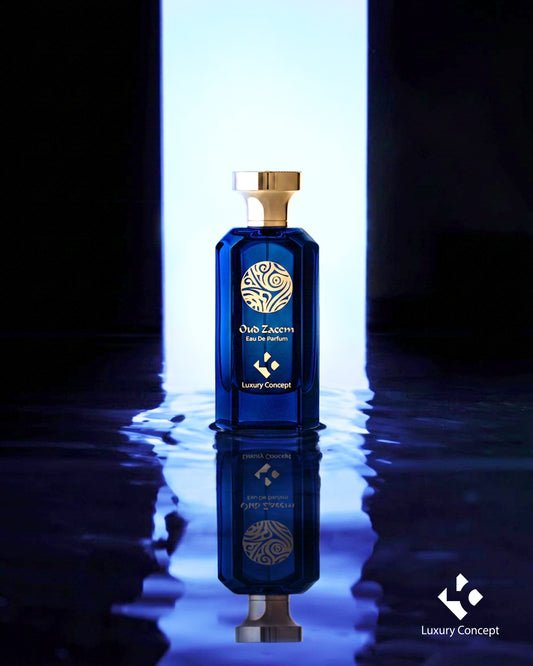 Oud Zaeem luxury blue oud perfume bottle with gold cap surrounded by reflective water and clean white sky inspired lighting