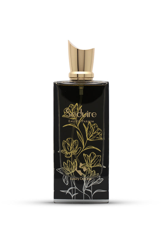 A woody floral perfume. A black perfume bottle with gold accents and floral designs.