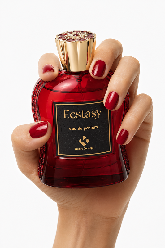 Ecstasy is a Boozy gourmand perfume from Luxury Concept. A hand with red nail polish holds a red glass perfume bottle labeled 'Ecstasy eau de parfum' against a clean white background.